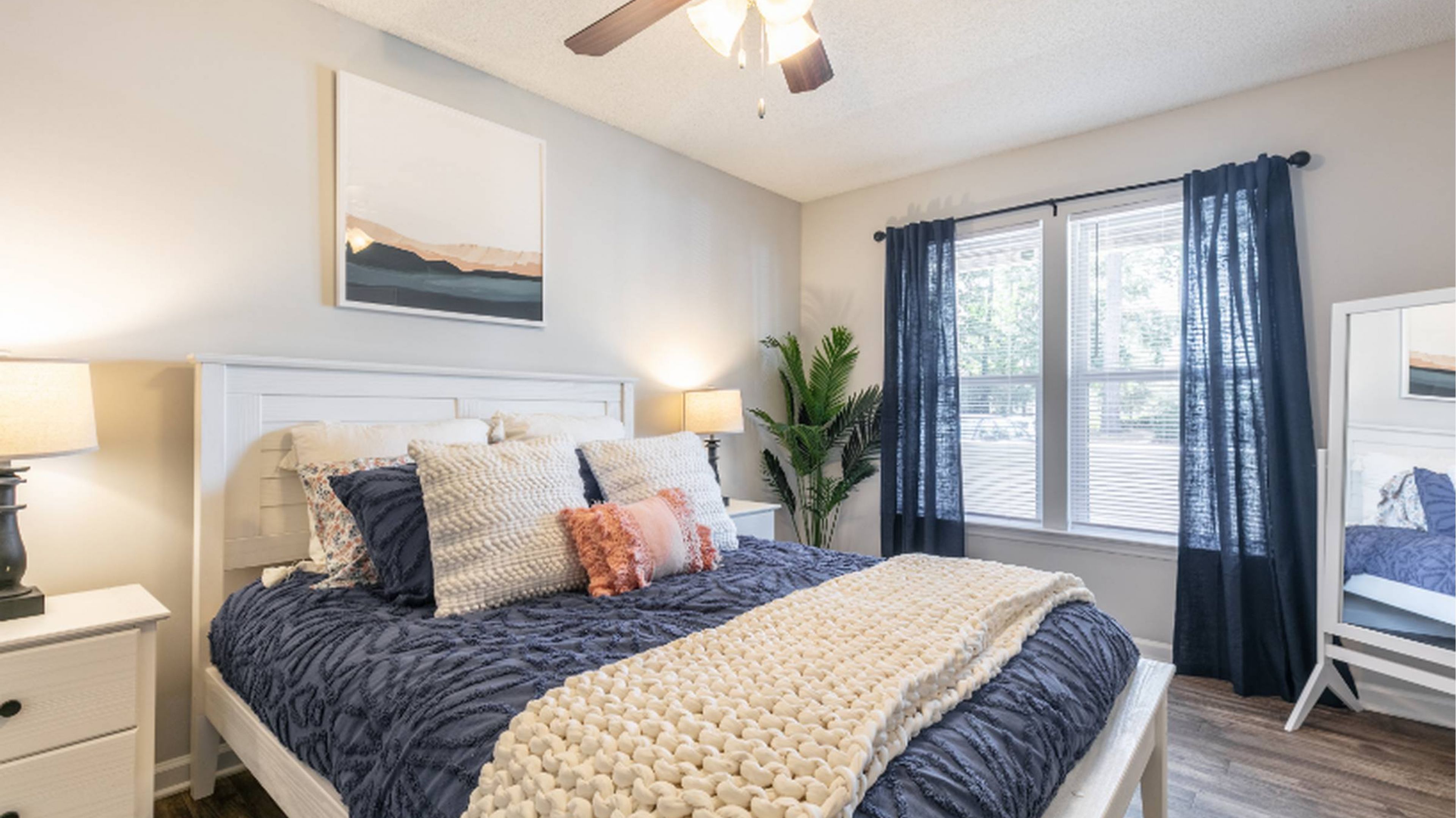 Hawthorne at New Centre apartment bedroom with coastal decor at Hawthorne at New Centre